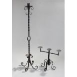 Iron candelabra, with a socket to the top above a twist column and scroll base, together with a