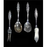 Scandinavian set of flatware to include two sifters spoons, butter knife and a two pronged fork. 4.