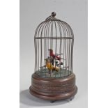 Singing bird musical automaton, the cage above red and yellow birds on branches, the plinth base