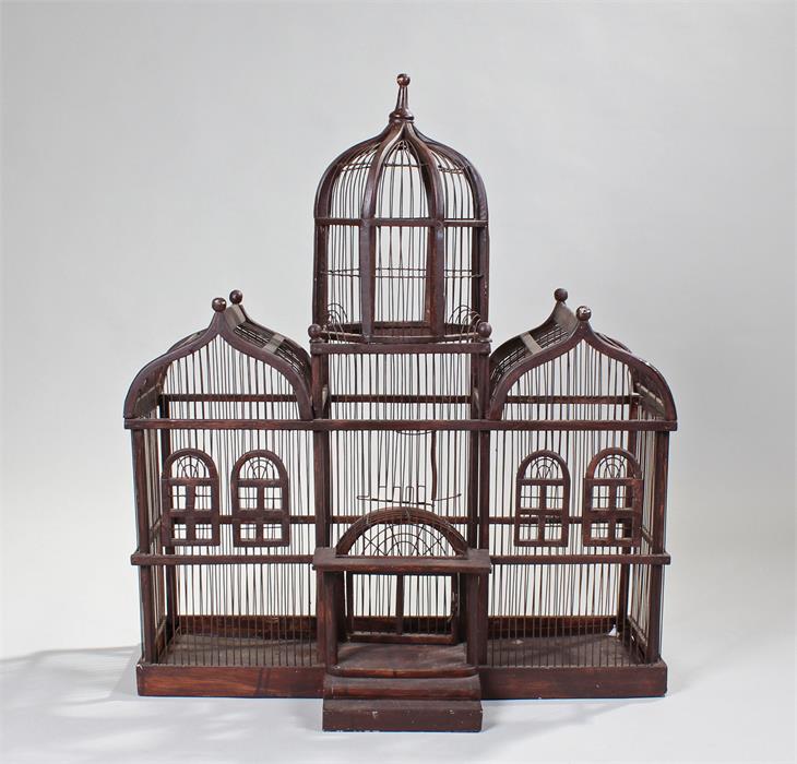 Bird cage designed as a grand house with arched gable ends, a dome and entrance porch. height 81cm