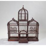Bird cage designed as a grand house with arched gable ends, a dome and entrance porch. height 81cm