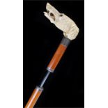 Exceedingly fine Victorian ivory dog head sword stick, the large carved head with glass eyes, a