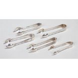 Silver sugar tongs, to include a pair of small proportions, a scroll pair, a shield pair and