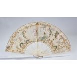 18th Century silk hand painted fan, the central panel decorated with three figures in a garden, with