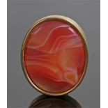 Agate brooch, the red/orange agate set within a yellow metal mount, 37mm high