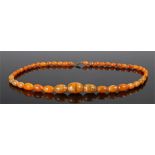 Amber necklace, with reconstituted beads from marble effect to orange, largest bead 30mm diameter,