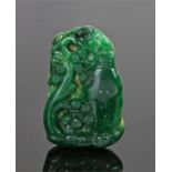 Chinese jade pendant, the deep green pendant carved with storks and flowers, 52mm high