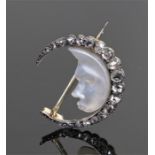 Diamond and moonstone brooch, the crescent diamond arch with a carved moonstone as the moon with a