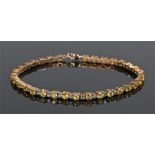 9 carat gold yellow and green sapphire bracelet, each round cut on gold, 19cm long