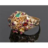 14 carat gold multi gemstone ring, the tapering head set with sapphires, emeralds, ruby, garnet