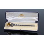 Scottish white metal kilt pin/brooch, with an orange stone above the twist column, boxed, the pin