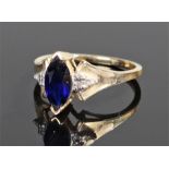 Yellow metal sapphire and diamond ring, the naiveté sapphire flanked by diamonds, N 1/2