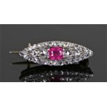 Diamond and ruby brooch, the central ruby with a diamond surround, 26mm diameter