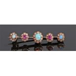 Opal pearl and ruby bar brooch, set in flower heads to the bar brooch, 31mm long