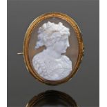 Victorian carved agate cameo, carved as a lady with a yellow metal frame and pin to the back, 37mm