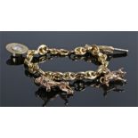 9 carat gold bracelet, set with a hat compass charm, a lion, a bull and a pistol to the chain, 34.