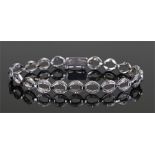 Diamond set bracelet, each link with two diamonds set to the edge on white metal, 19.5cm long