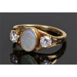 18 carat gold opal set ring, with a central oval opal, ring size L