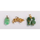Pendants, to include a yellow metal bull, a jade elephant with yellow metal mounts and a Chinese