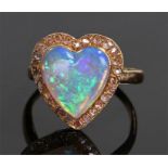 18 carat gold opal and diamond ring, the heart shaped opal with a diamond surround, ring size O