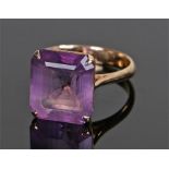 18 carat gold amethyst ring, the amethyst set within a four claw mount, ring size O