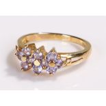 9 carat gold ring, set with stones to form flower heads, ring size N 1/2