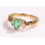9 carat gold emerald ring, flanked by diamonds, ring size O