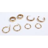Four pairs of 9 carat gold earrings, each of loop design, 6.9 grams