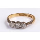18 carat and diamond ring, the ring set with three diamonds to the head,1.8 grams