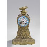 French gilt metal mantel clock, with an enamel dial and Roman hours, AF