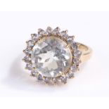 9 carat gold ring, with a large stone and pale blue stone surround, ring size N