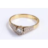 18 carat gold diamond set ring, the central diamond with bark effect shoulders, 3.8 grams