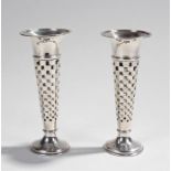 Pair of silver bud vases, Birmingham 1947, the tapering bodies with square fret design, 16cm