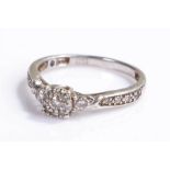 White metal diamond set ring, with a diamond to the head and shoulders, ring size M