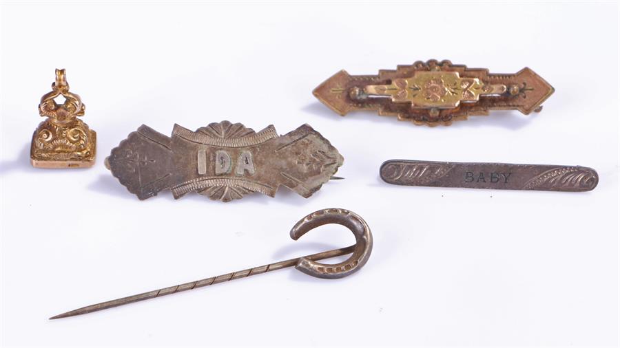 9 carat gold seal, with red stone, together with three brooches and a stick pin with a horse