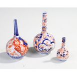 Three late 19th century fluted Imari vases, largest 17cm in height (3)