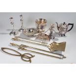 Silver plated wares to include candlesticks, coffee pot, dish, etc, together with some brass