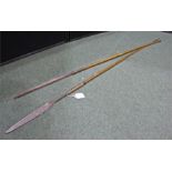 Two African spears, iron spear heads with tapering wooden shafts, 154 cm and 139.5 cm in length, (