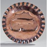 Early 20th Century hammered copper dish, centred by an Airship, wavy border, 19cm diameter