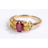 9 carat gold simulated ruby ring, with a central simulated ruby flanked by stones