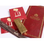 Dunhill lighter, gold plated with engine turned case, together with a diary and lighter fliters