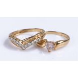 Two 9 carat gold rings, the first of arched design the second with a cubic zirconia, (2)