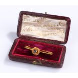 15 carat gold sapphire set brooch, the central sapphire with rope twist surround, 30mm diameter, 1.8