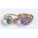 Two 9 carat gold rings, the first with an emerald, AF, the second with a row of purple stones, one