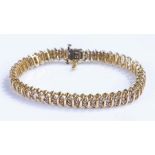 10 carat gold diamond set bracelet, with one hundred and fifty round cut diamonds to the linked