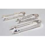 Three pairs of silver sugar tongs, to include a bright cut pair, London 1818, another bright cut