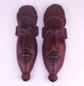 2 Masken - Niger, Gesichtsmasken, Holz geschnitzt, braunbemalt, schmale längliche Gesichtszüge,