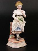 Mädchenfigur - Volkstedt um 1870, Porzellan, bunt staffiert,vollplastische Figur eines lieblichen