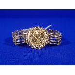 22CT GOLD HALF SOVEREIGN 1982 MOUNTED IN A 9CT GOLD GATE BRACELET