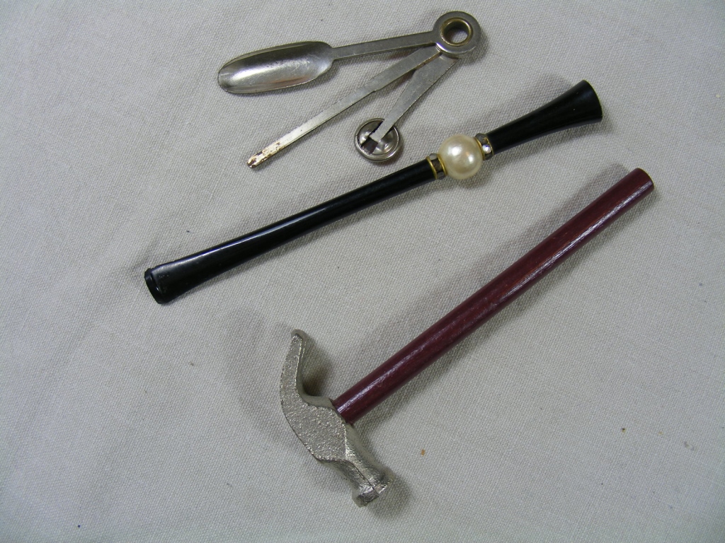 Cigarette Holder, Pipe Tool and Toffee Hammer
